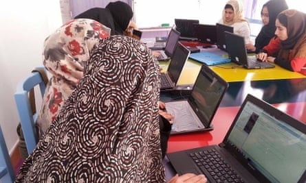 Girls in Afghanistan working on laptops