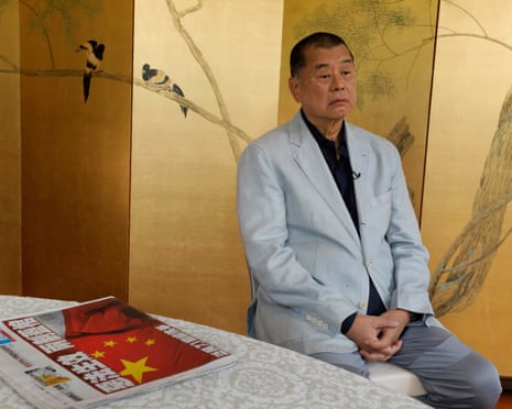 Hong Kong media tycoon Jimmy Lai with a copy of his Apple Daily newspaper during an interview in Hong Kong in July 2020.