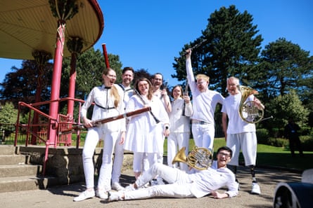 Members of Paraorchestra in front of a bandstand