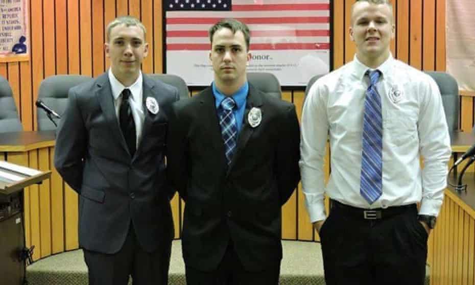 As part of the settlement, Stephen Mader, center, was also granted a pledge that his former employer would not prevent him from obtaining a new job in law enforcement elsewhere.