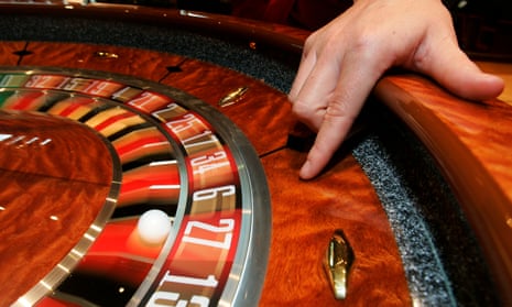 A croupier with a roulette wheel