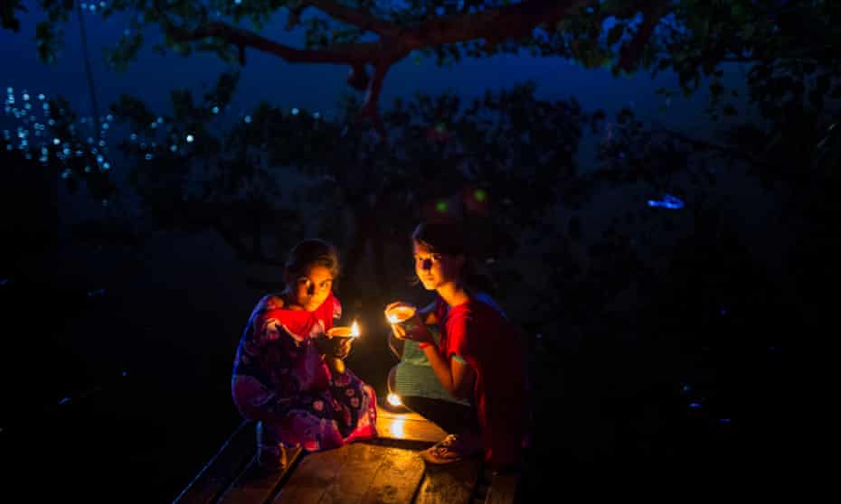 ‘There is a sweetness in the way we shape our lives around light’ ... two girls celebrate Diwali in Bangladesh.