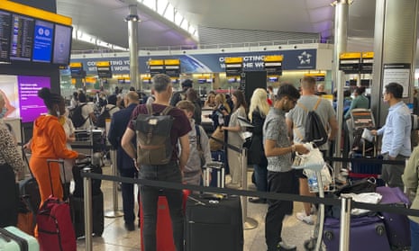 Airport filled with delayed passengers queueing