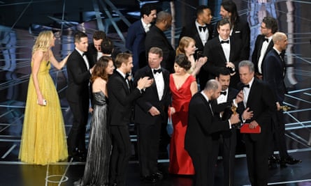 La La Land producer Jordan Horowitz (lower left) stops the show to announce the actual Best Picture winner as Moonlight in 2017/