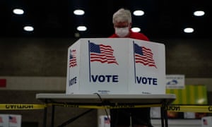 A voter completes his ballot in Louisville