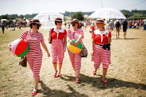 Festival ballers caught in beach balls run behind other stages.