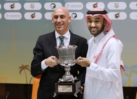 Luis Rubiales, left, and Saudi General Sport Authority chairman Prince Abdulaziz bin Turki Al-Faisal carry the Spanish football Super Cup during a press conference in 2019.
