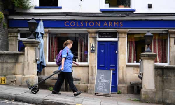 A nurse walks past the Colston Arms pub in Bristol, Britain, 09 June 2020