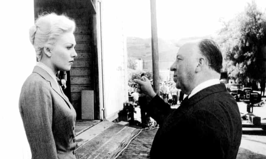 Kim Novak takes direction from Alfred Hitchcock on the set of Vertigo