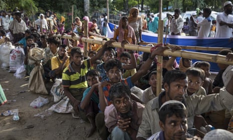 Rohingya people who have fled Myanmar wait for aid and transport to camps in Cox’s Bazar, Bangladesh