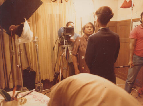 two people in front of a camera