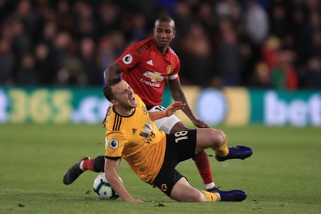 Ashley Young of Manchester United fouls Diogo Jota.