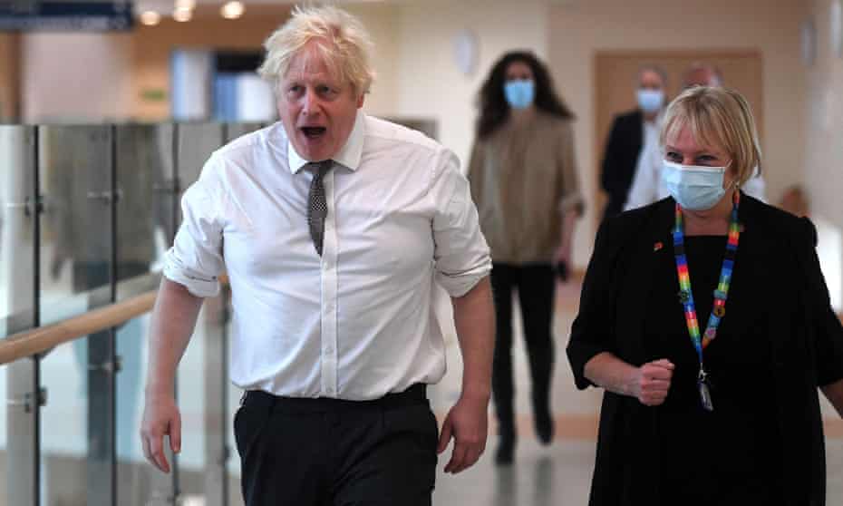 Boris Johnson (not wearing a mask) on a visit to Hexham general hospital in Northumberland on the day MPs in the Commons held an emergency debate on sleaze.