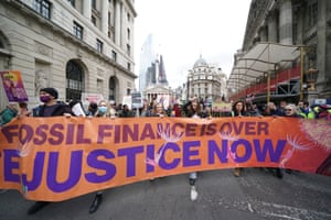banner reads: Fossil finance is over, climate justice now
