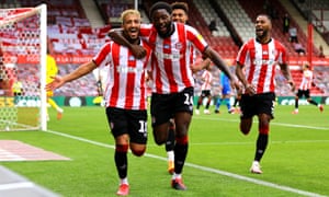 Brentford’s Said Benrahma (left) celebrates scoring his side’s third goal of the game and his hat-trick with team-mates Josh Da Silva and Ollie Watkins.