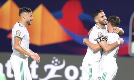 Riyad Mahrez (centre) celebrates with teammates as Algeria beat Kenya 2-0 in Cairo.
