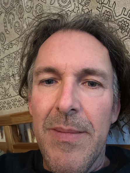 Brad Southard, a man with tousled greying hair and stubble, in a closeup selfie