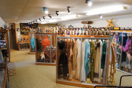Hore’s tractor shed ‘museum’ seen in about 2000, showing cases filled with gowns and collectibles stacked on and in the cases.