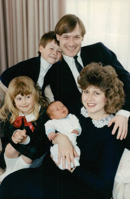 The family poses for a formal portrait