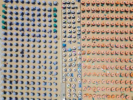 Seen from the air, regimented rows of beach umbrellas owned by the private operators in Gaeta.