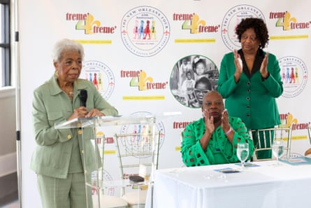 a woman speaks into a microphone