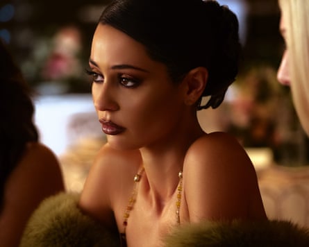 Woman in green evening dress looks ahead