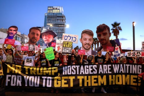Activists hold portraits of Israeli hostages held in the Gaza Strip by Palestinian militants since the October 7, 2023 attacks, during a protest calling for their release and an end to the war, outside the the Branch Office of the Embassy of the United States of America in Tel Aviv on July 7, 2025. (Photo by Menahem Kahana / AFP) (Photo by MENAHEM KAHANA/AFP via Getty Images)