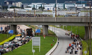 Travellers attempt to reach the airport after protesters blocked roads
