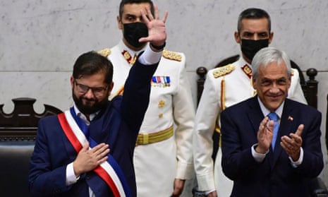 Gabriel Boric, Chile's new president, is applauded by his predecessor at the inauguration ceremony in Valparaiso on Friday.