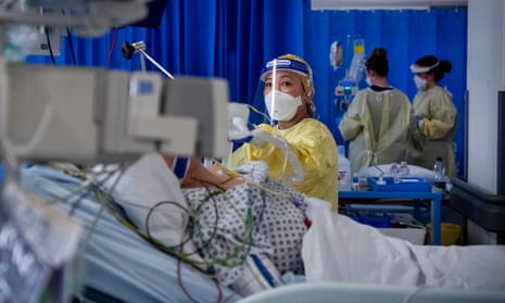 A nurse works on a patient in the ICU at St George’s Hospital in Tooting.