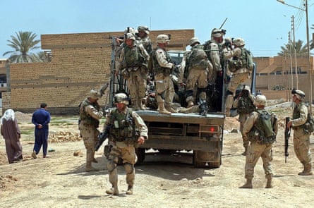 US soldiers patrol a suburb of Baghdad in April 2003.