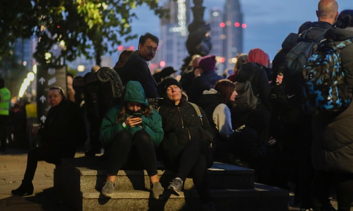 People queue to pay their respects to Queen Elizabeth II lying in state at the Palace of Westminster.