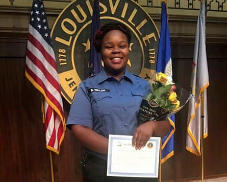An undated file photo shows Breonna Taylor in Louisville, Kentucky with US flag behind.