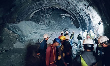 Rescue workers gather at the site after a tunnel collapsed in the Uttarkashi district of India’s Uttarakhand state