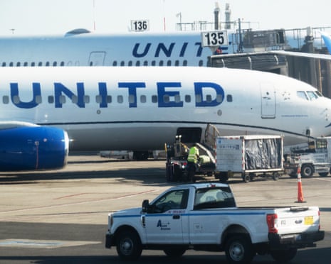 United planes, with the cargo area open on the one in front.