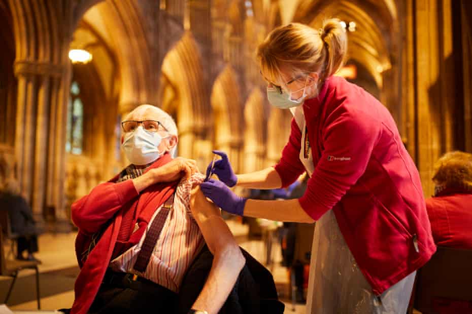 Sister Elaine Stokes giving local resident Leo Fielding his first Covid-19 injection at Lichfield Cathedral.