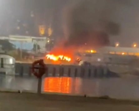Blurry image of a fire at a port