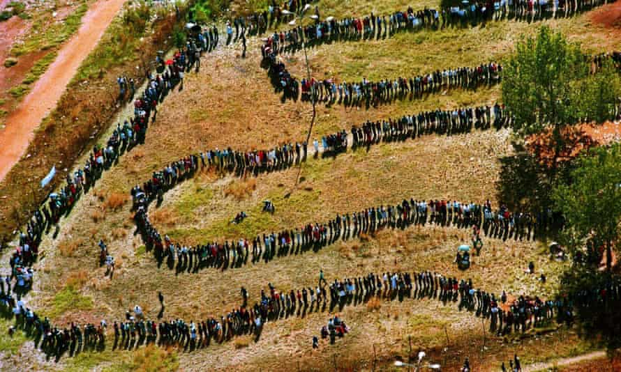 People queue to cast their votes in Soweto in the 1994 election