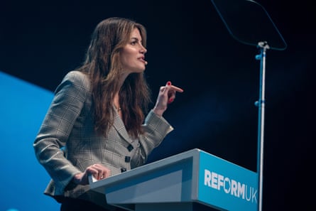 Laila Cunningham speaks during a party rally in London at a podium with Reform UK on it