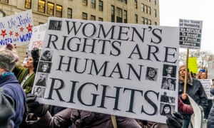 Protestors waving women's rights banners