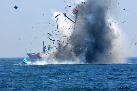 The Indonesian navy blows up a foreign vessel caught fishing illegally in Indonesian waters at Lemukutan Island, Kalimantan.