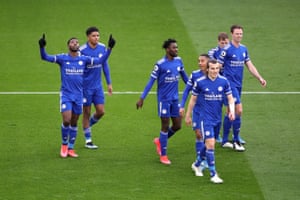Kelechi Iheanacho (L) of Leicester City celebrates with team mates after scoring their third goal.