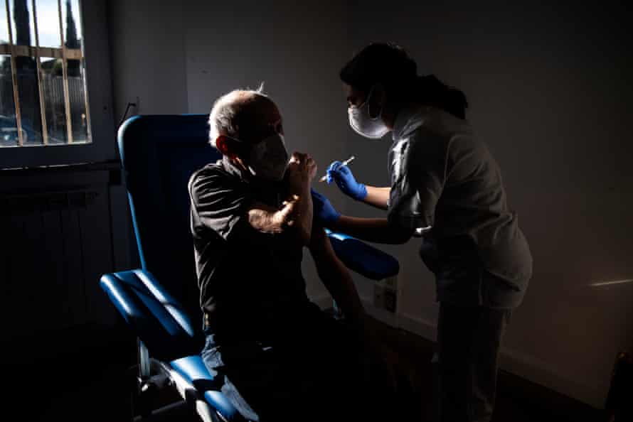 A healthcare worker gives the Pfizer Covid-19 vaccine to a man over 80 years old in Rome, Italy.