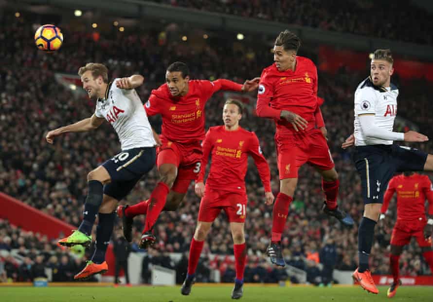 Tottenham Hotspur’s Harry Kane, left, and Liverpool’s Joel Matip go up for a header.