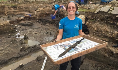Dig volunteer Sarah Baker with one of the rare cavalry swords.