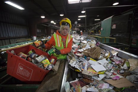 Workers sort paper and plastic waste at in Hillsboro, Oregon, in 2017 – the year China changed its recycling policies.