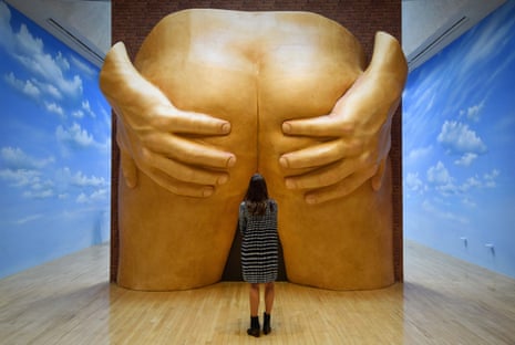 A member of staff poses next to an installation by the British artist Anthea Hamilton at Tate Britain in London