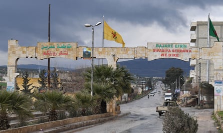 A YPG flag flying near an entrance to the city of Afrin.