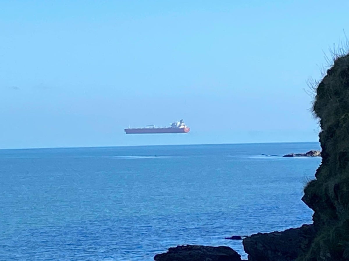 walker stunned to see ship hovering high above sea off cornwall science the guardian
