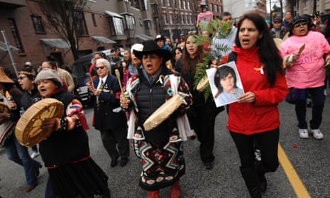 People attend a rally in remembrance of the missing and murdered women and girls in Vancouver in February.